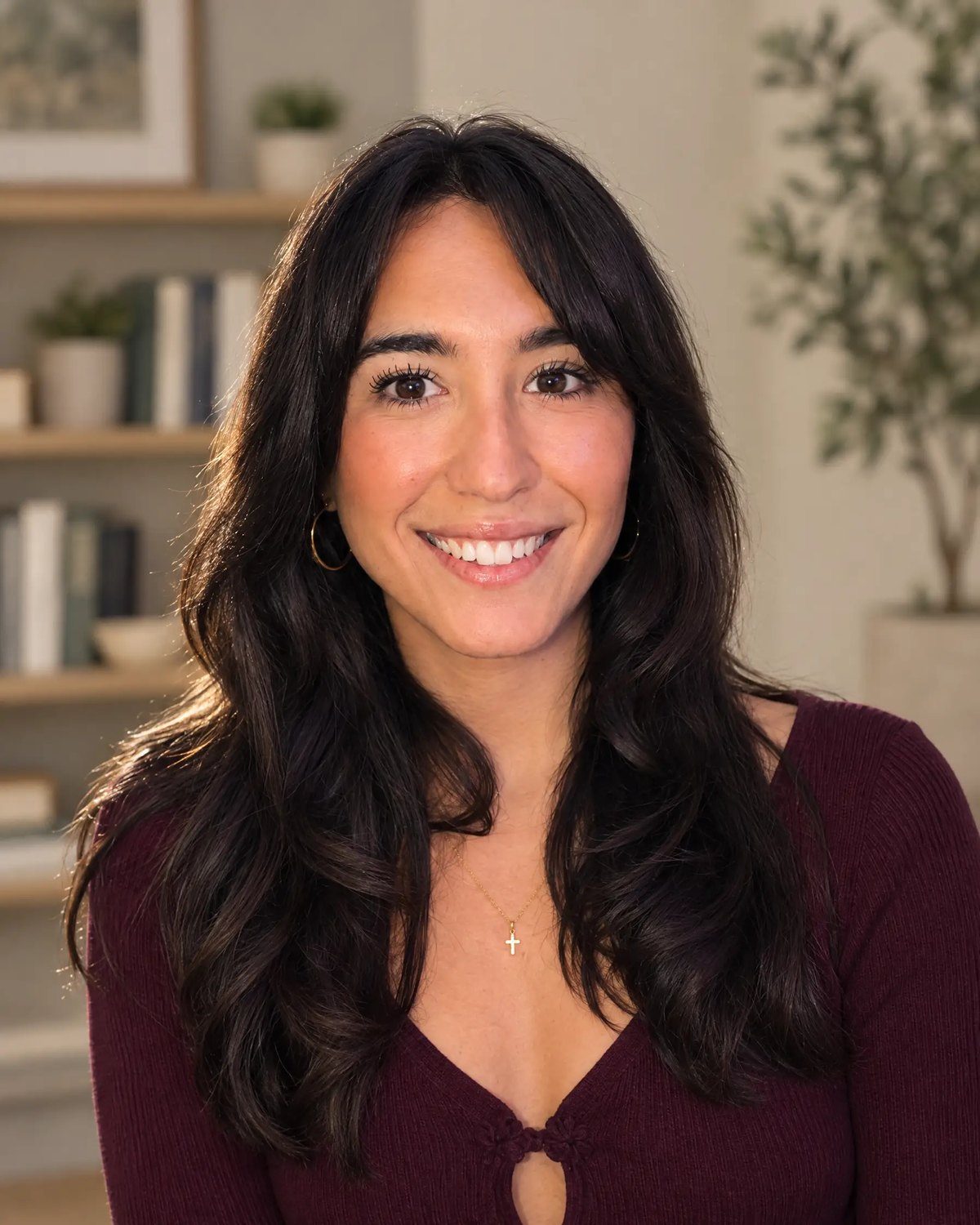Amanda Ribeiro, psychiatric nurse practitioner, smiling in her home office